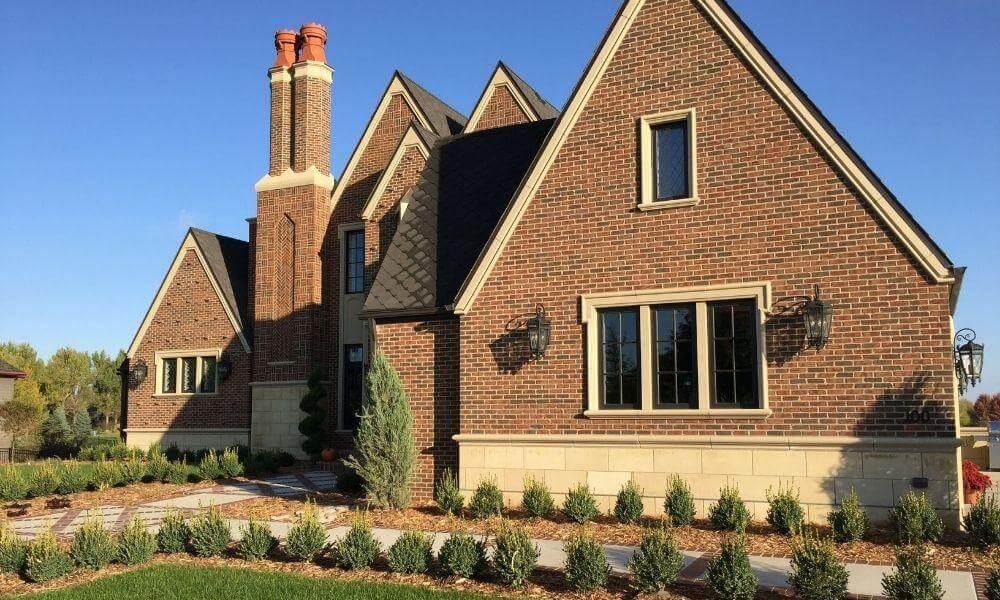 Large brick house with a tall chimney