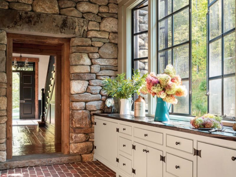 Contemporary Kitchen With White Cabinets And Brick Floor And Gray Countertops