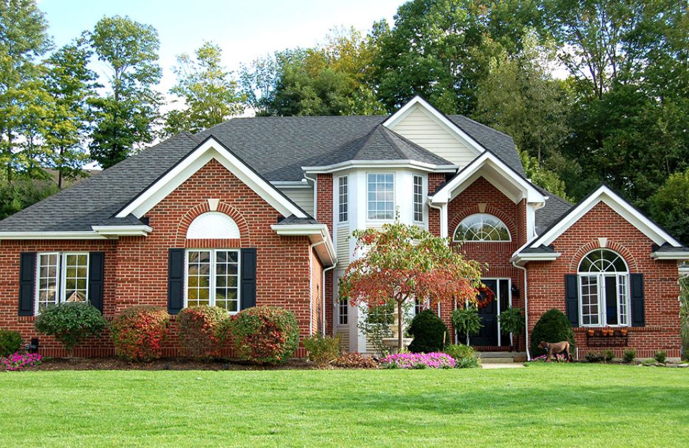 nice Brick home with green grass