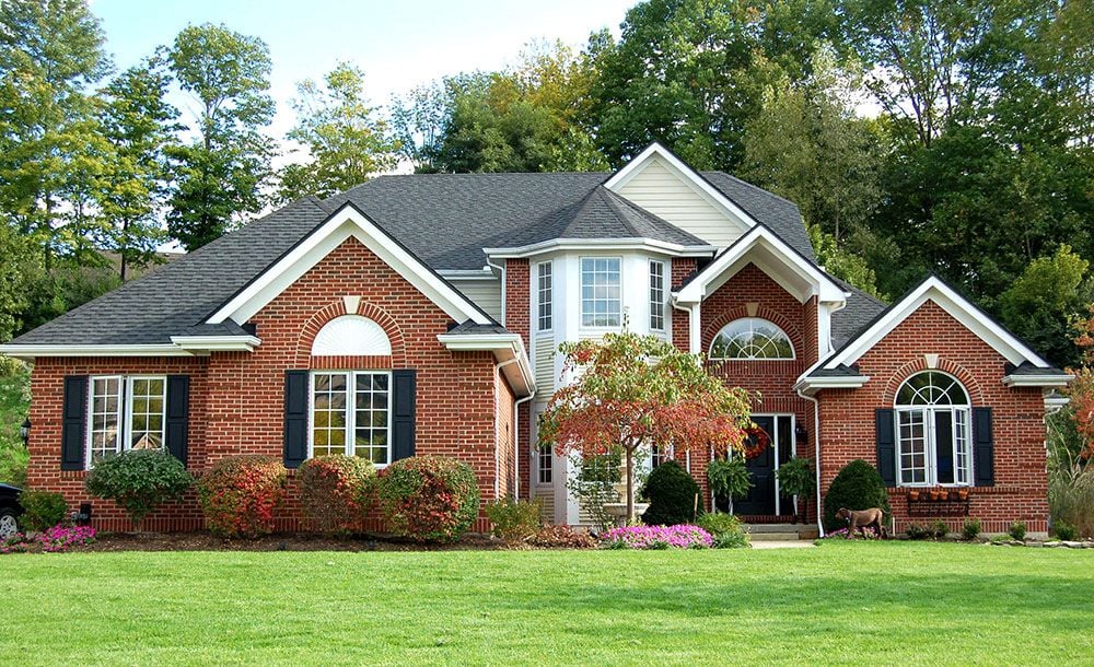 nice Brick home with green grass