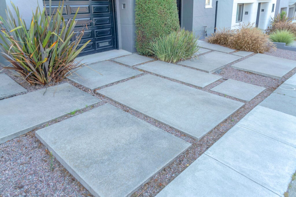 Staggered concrete pavers outside house