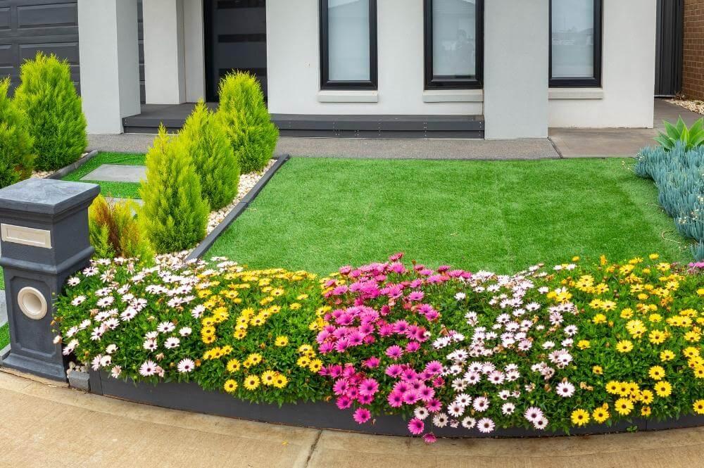 Small flower garden landscaping in front of a house