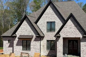 Brick house with a wooden bench